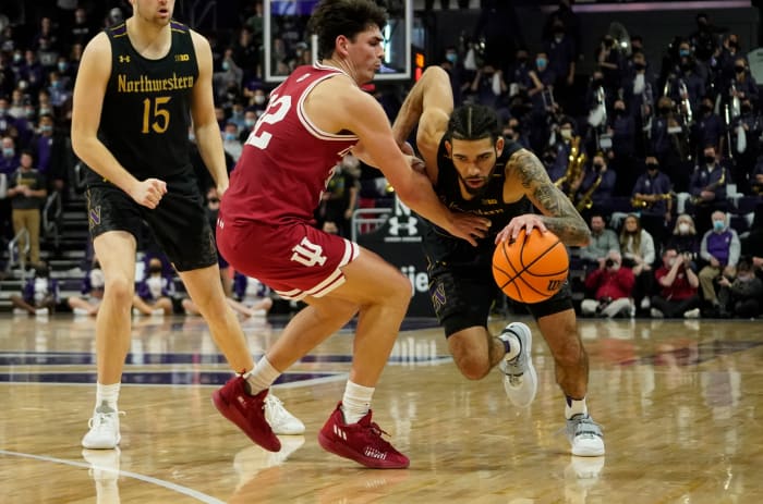 Feb 8, 2022; Evanston, Illinois, USA; Indiana Hoosiers guard Trey Galloway (32) defends Northwestern Wildcats guard Boo Buie (0) during the second half at Welsh-Ryan Arena.